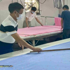 Fabric cutting for baby clothing manufacturing process